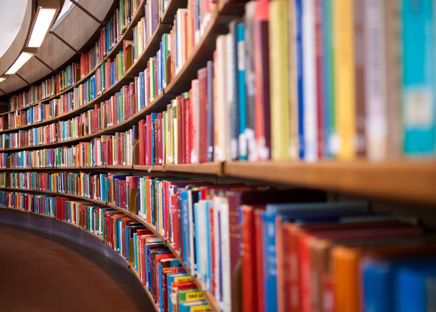 A row of books on shelves in a library.